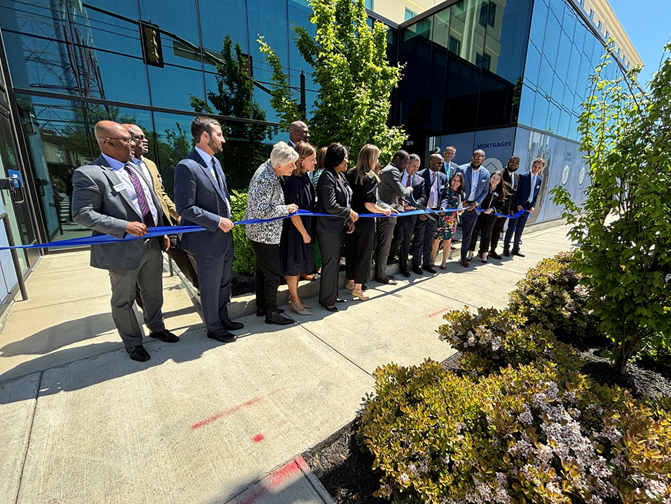 Community leaders join with Cavity Bank team members to cut the ribbon on the new financial center and commercial banking office at Scott’s Addition. 